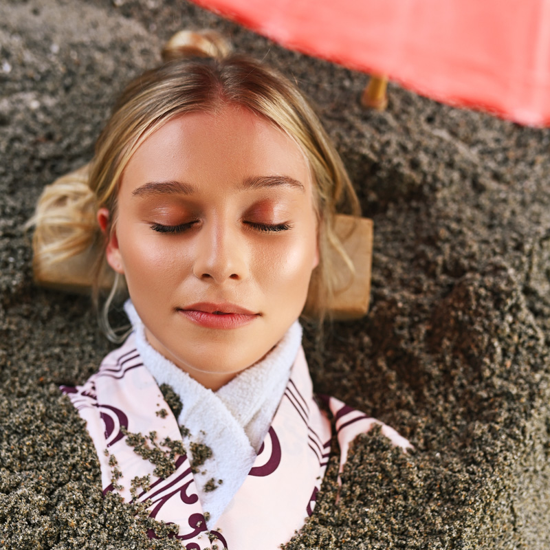Woman Relaxing Lifestyle Photography at SoJo Spa Club Volcanic Sand Bath