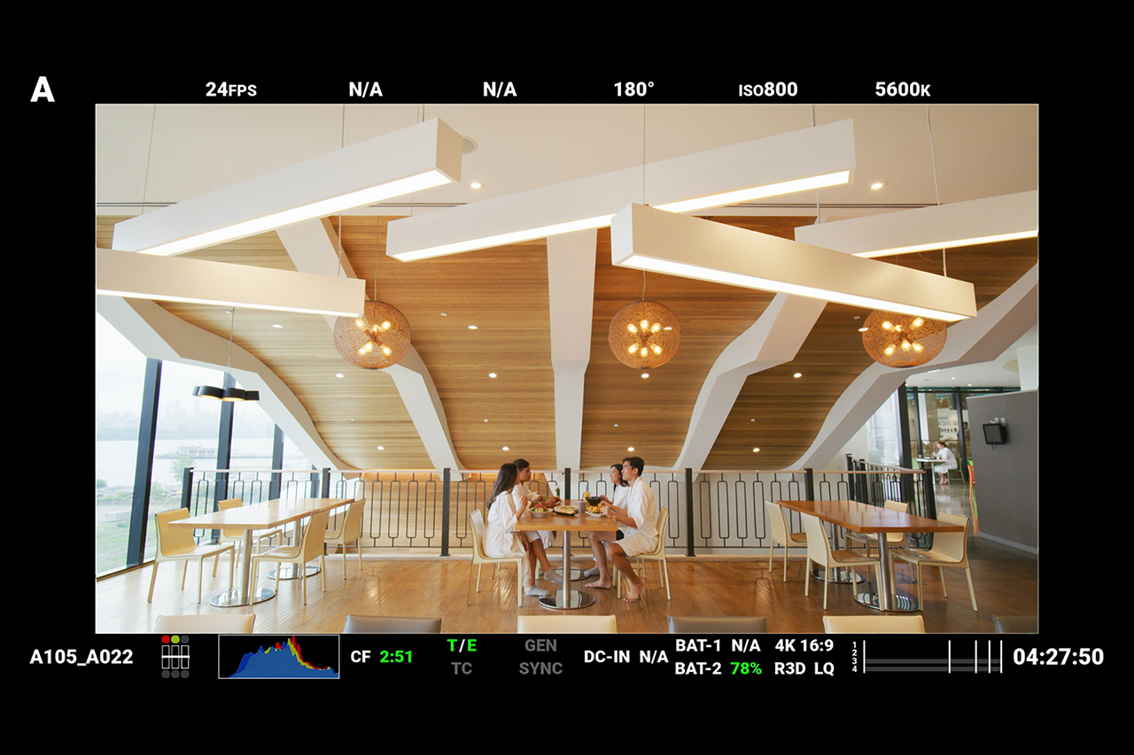 Red Digital Cinema camera monitor screenshot behind the scenes at SoJo Spa Club dining room.