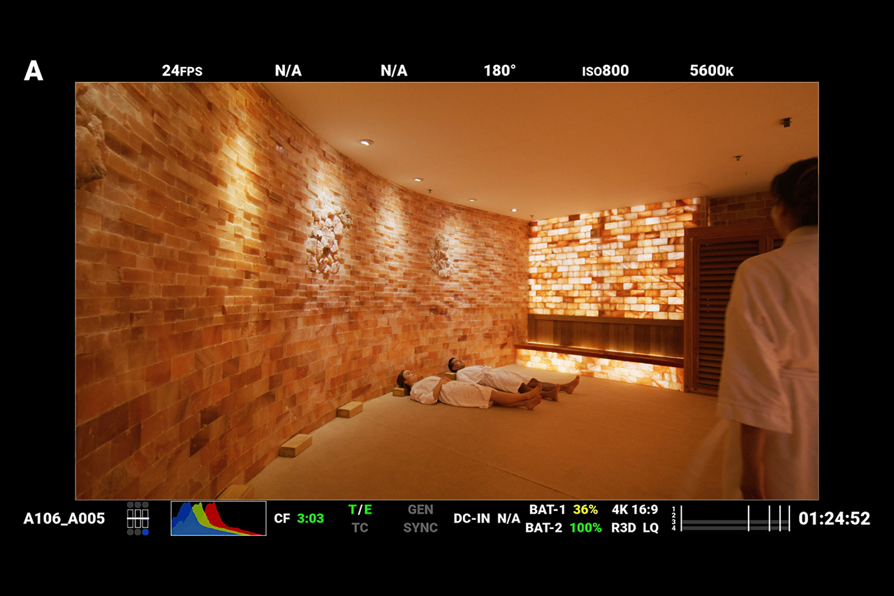 Red Digital Cinema camera monitor screenshot behind the scenes at SoJo Spa Club sauna.